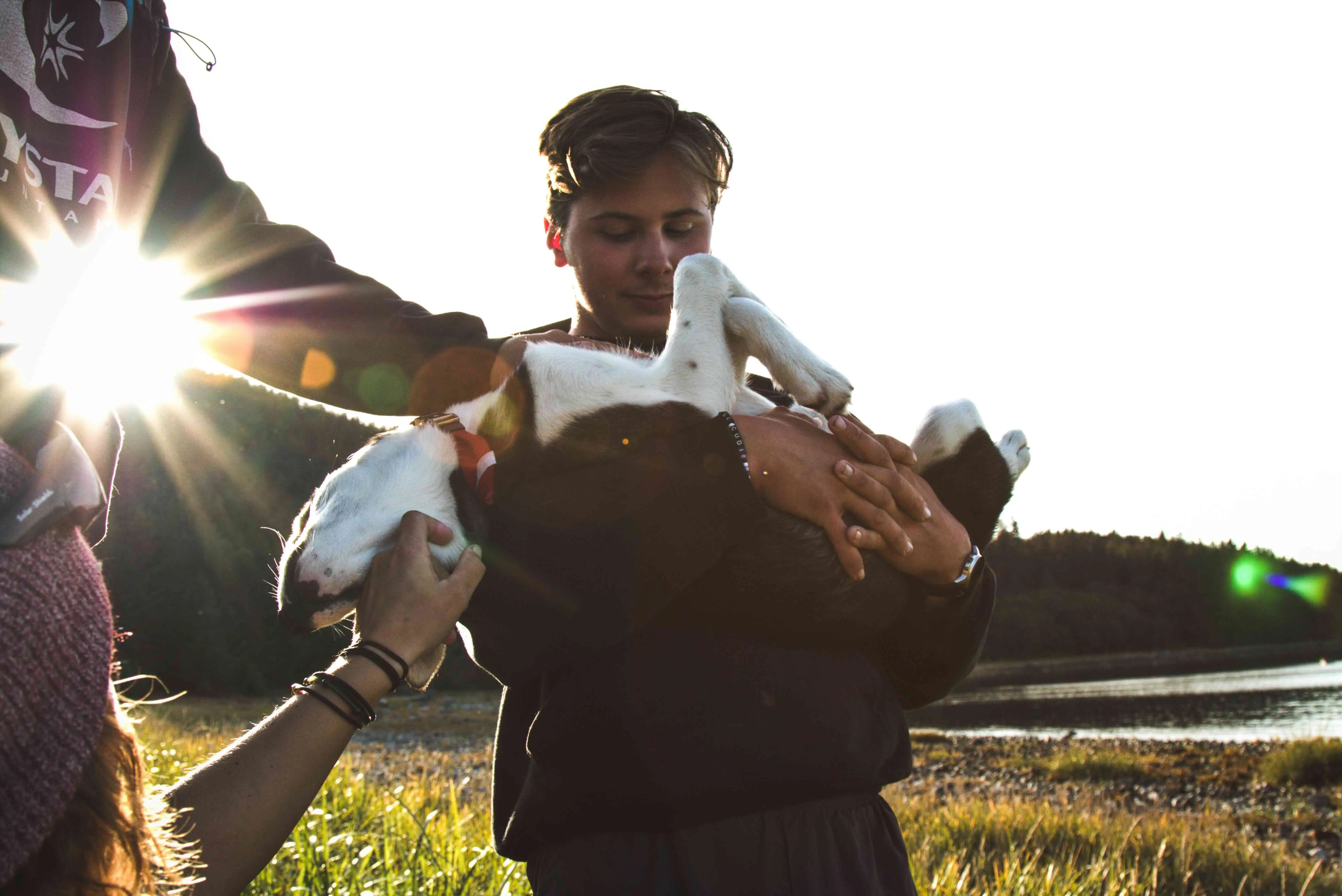 Sam holding his dog